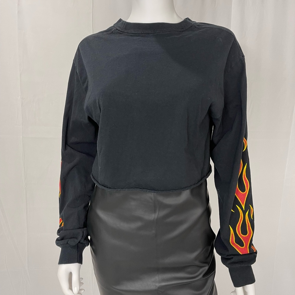 Forever 21. Black long sleeve crop top. With fire design on sleeve.